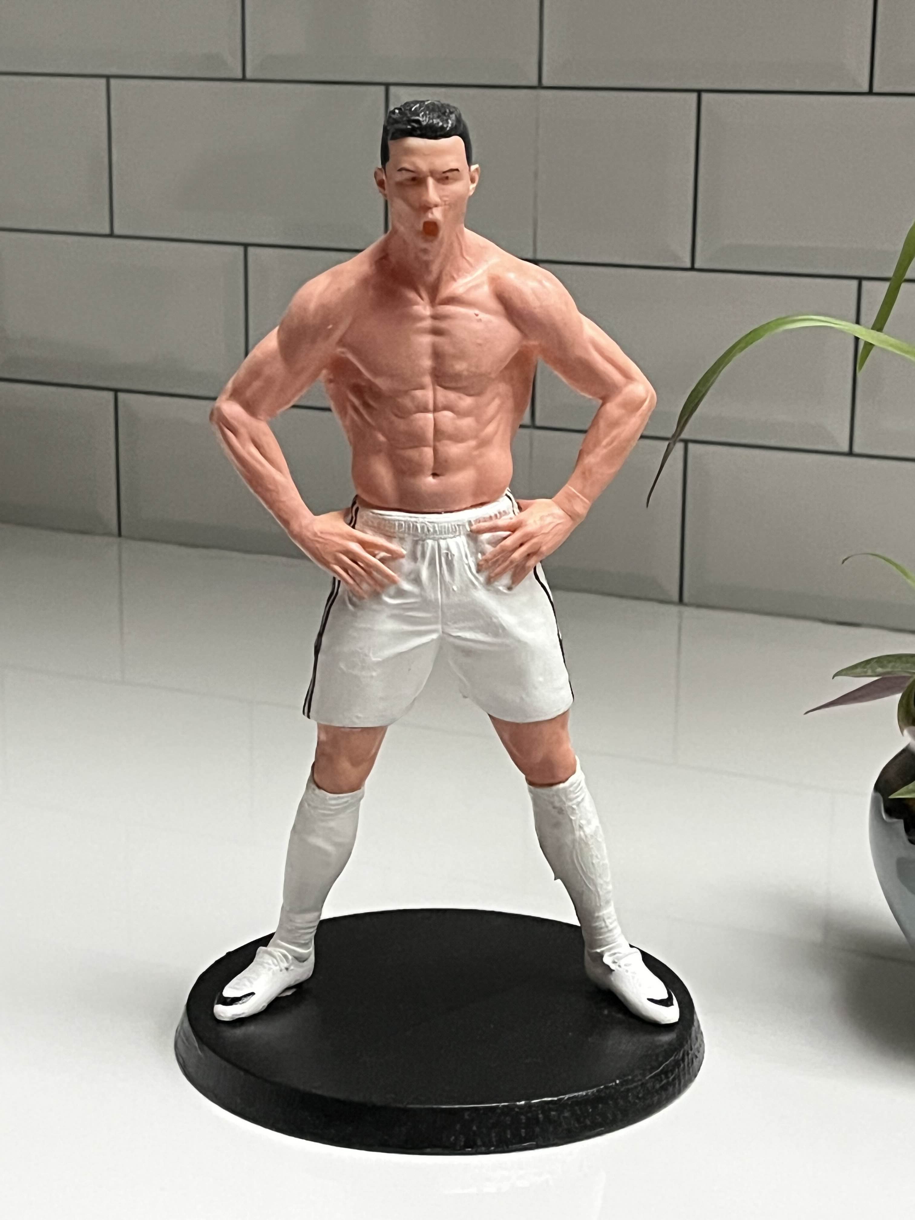 Celebration Pose Footballer Figurine – White Kit Collectible on Black Display Base