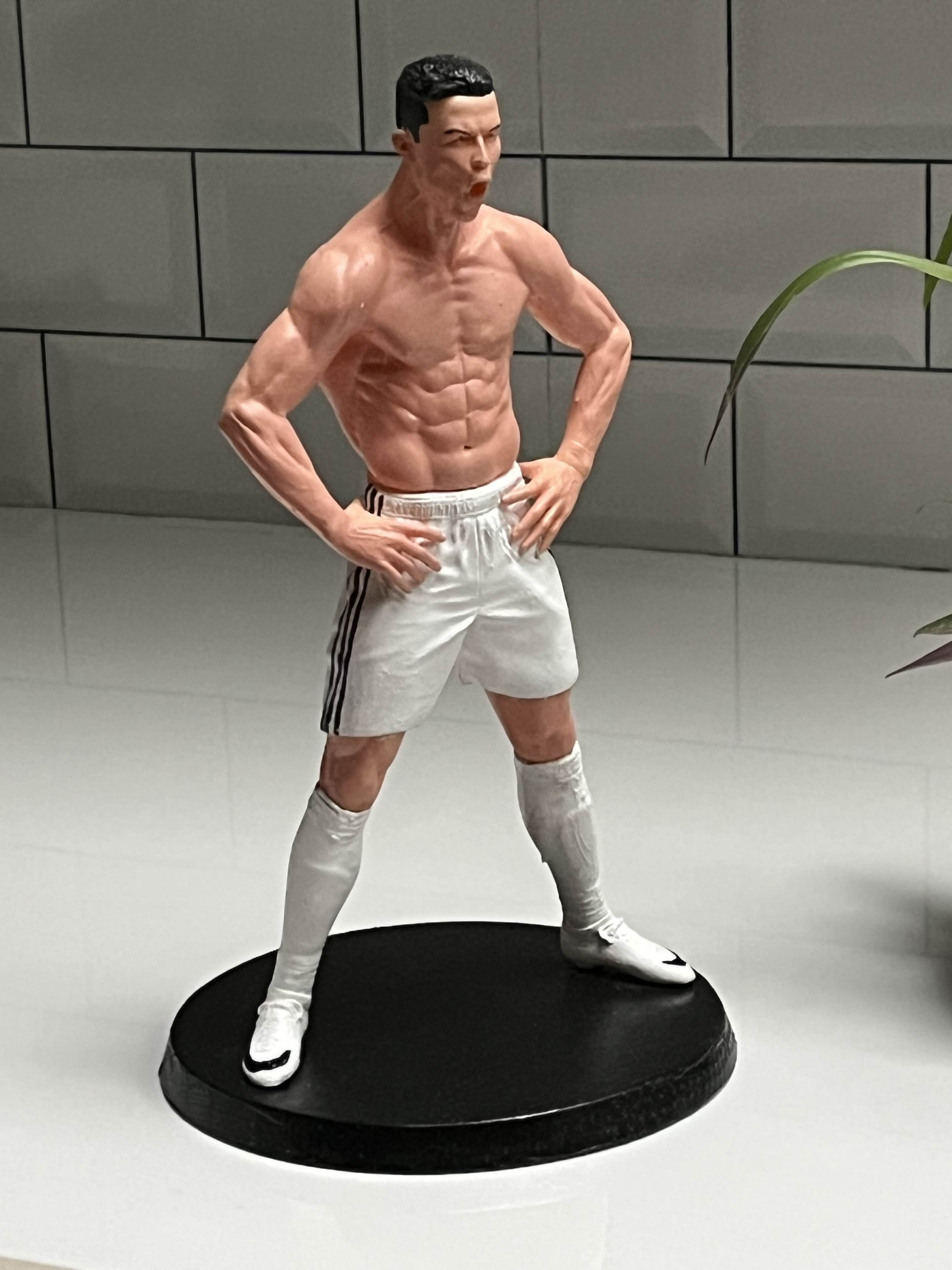 Celebration Pose Footballer Figurine – White Kit Collectible on Black Display Base